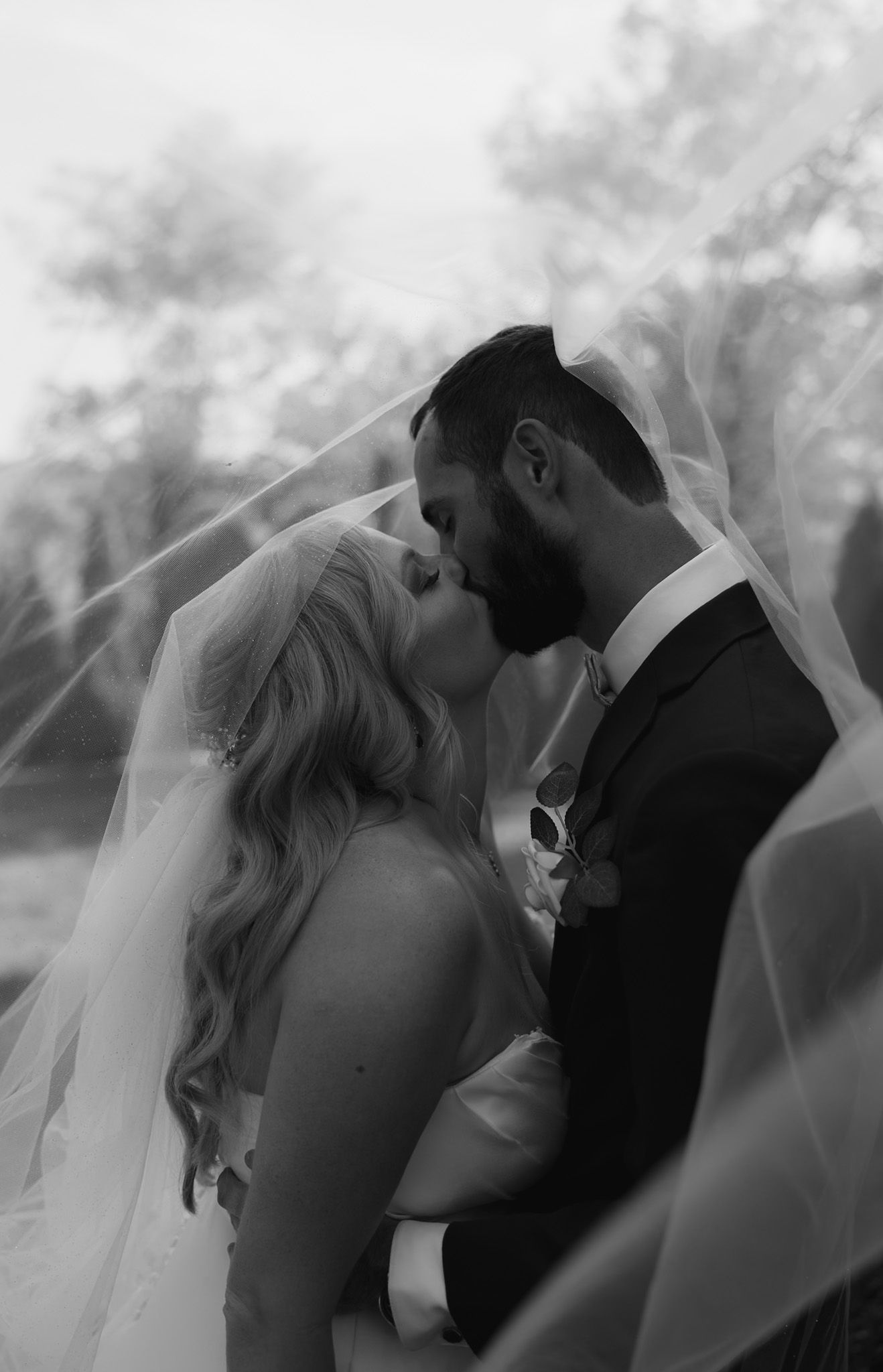 Romantic black and white sequence of wedding couple sharing intimate moments outdoors.