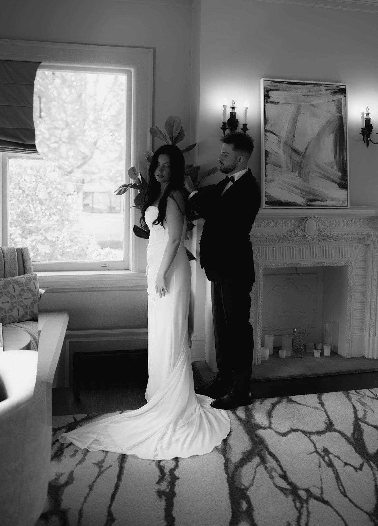 A sequence of dance moves captured in black and white in an elegant indoor setting.