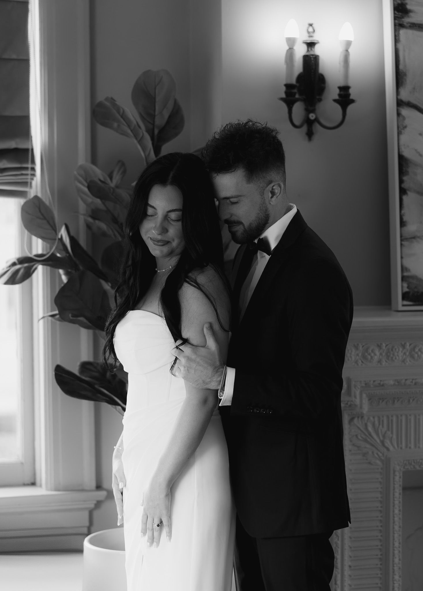 Intimate black and white sequence showing tender moments in an elegant room with classic decor.