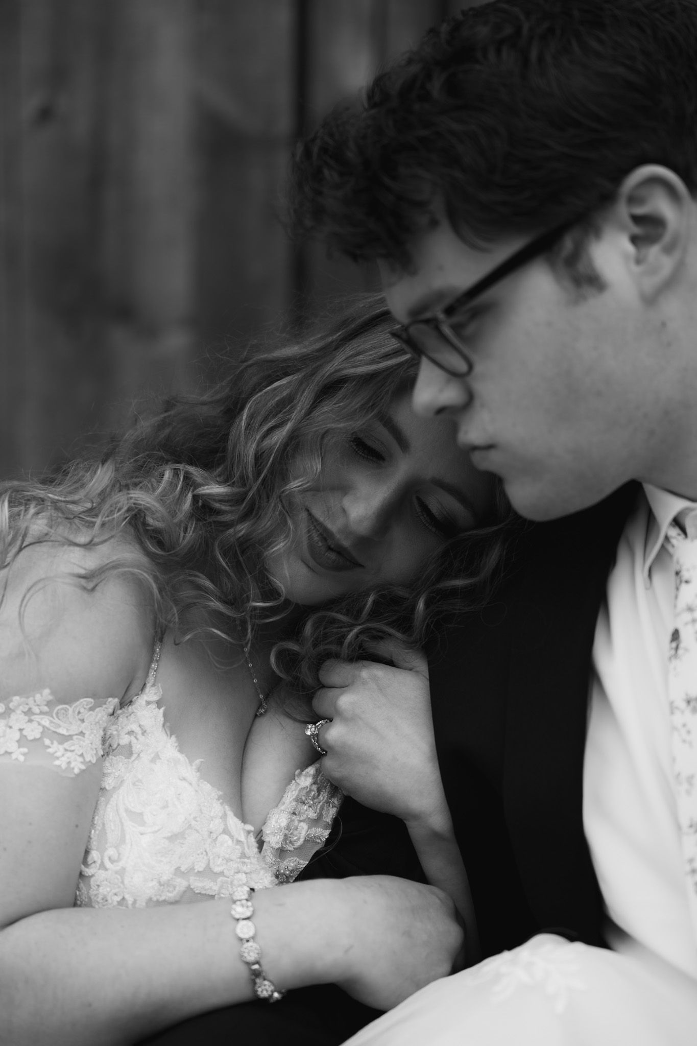 An intimate black and white portrait series showing tender romantic moments.
