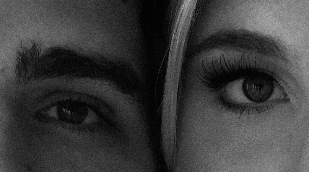 Dramatic black and white extreme close-up of eyes in artistic composition.