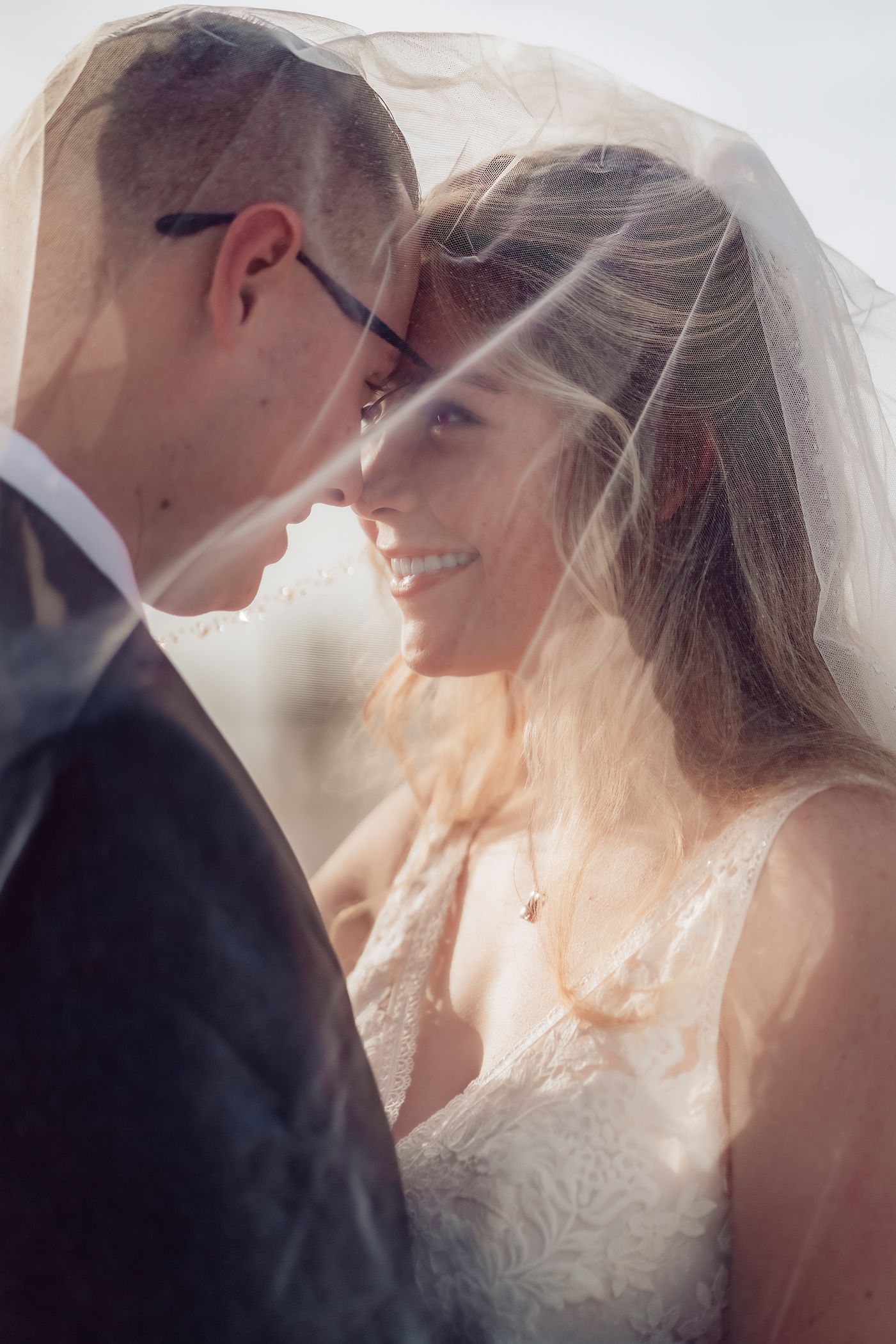 A romantic wedding moment captured in a series of soft-lit photos showing a couple in an intimate pose at sunset.