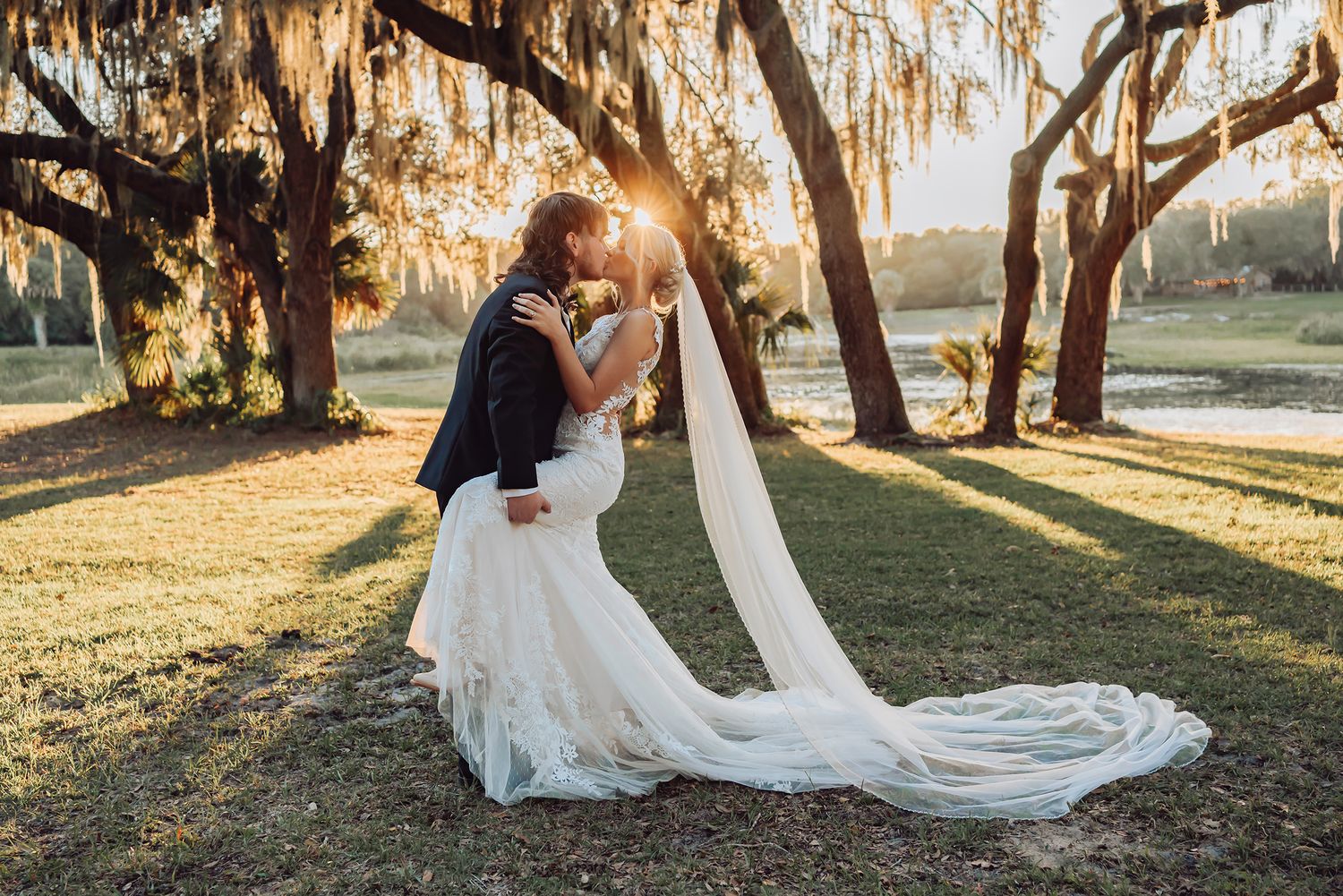Romantic wedding portraits under Spanish moss trees at golden hour wedding photography in Ocala, Florida by Lacy Jessica Photography