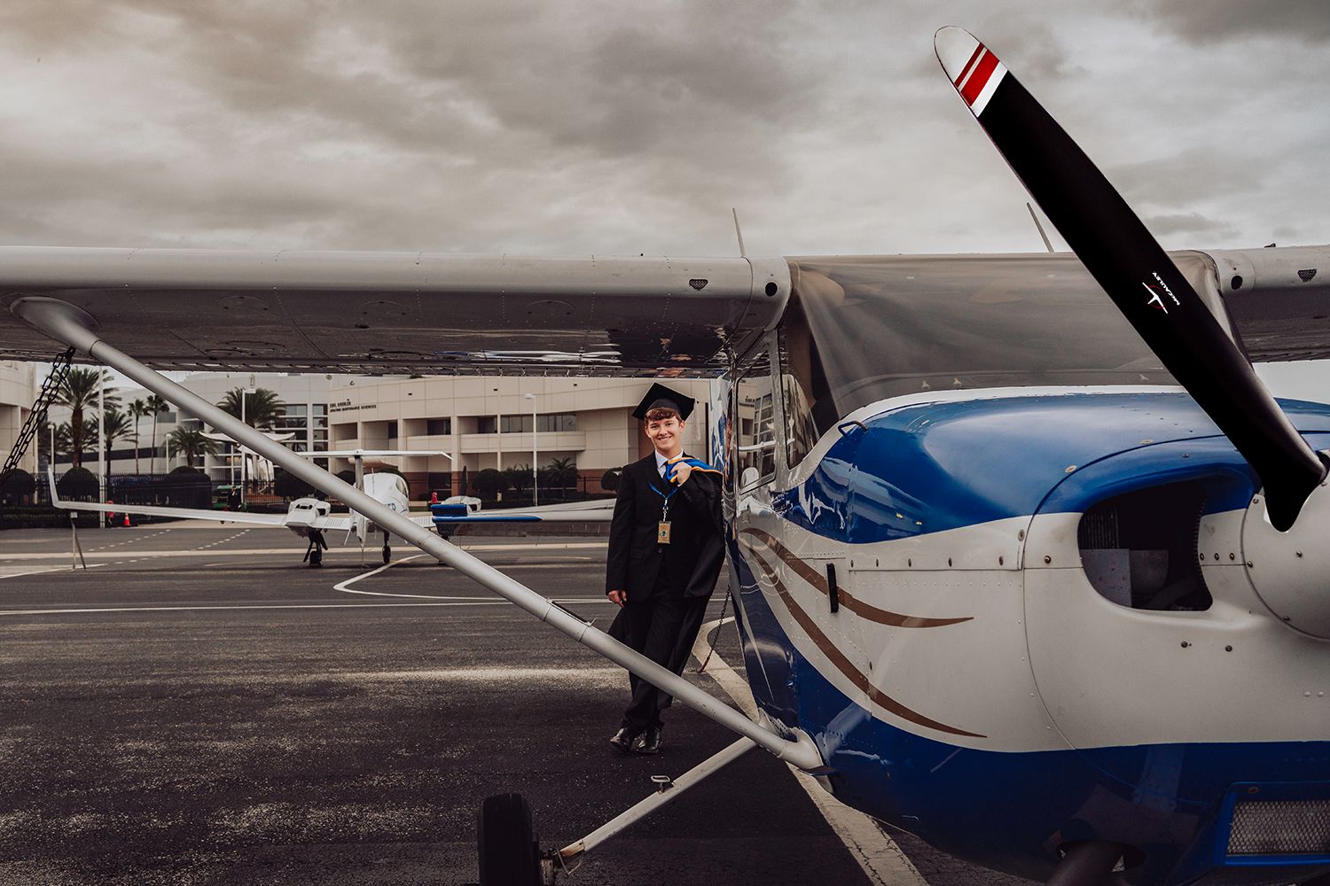 Graduation photos at Embry Riddle in Daytona Beach, FL with an airplane