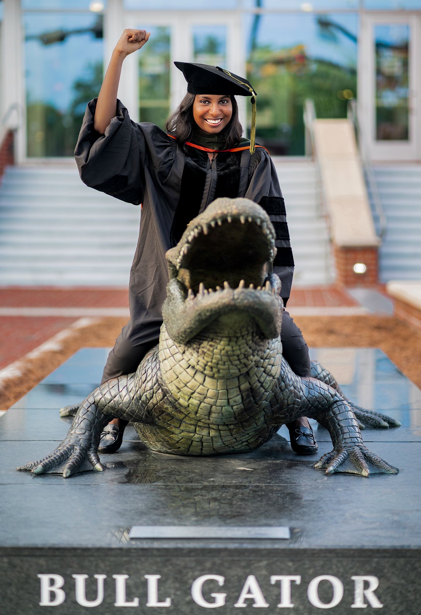 Graduate at the University of Florida poses on the Bull Gator in Gainesville, Florida.