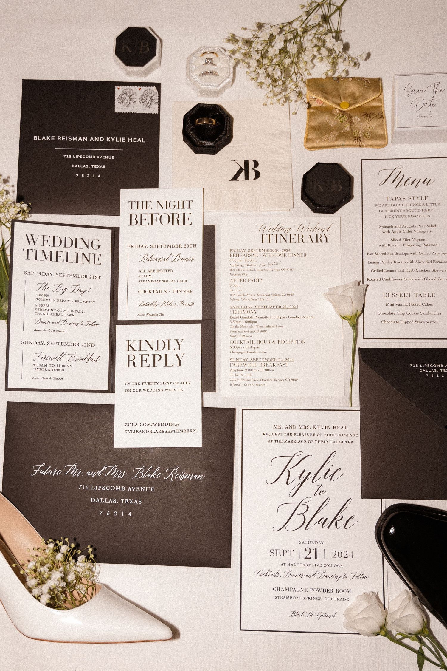 Elegant wedding invitation suite with black and white stationery and delicate floral accents.