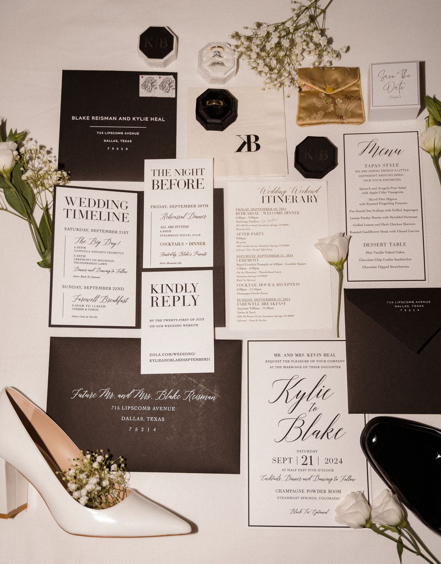 Elegant black and white wedding stationery suite with floral accents.