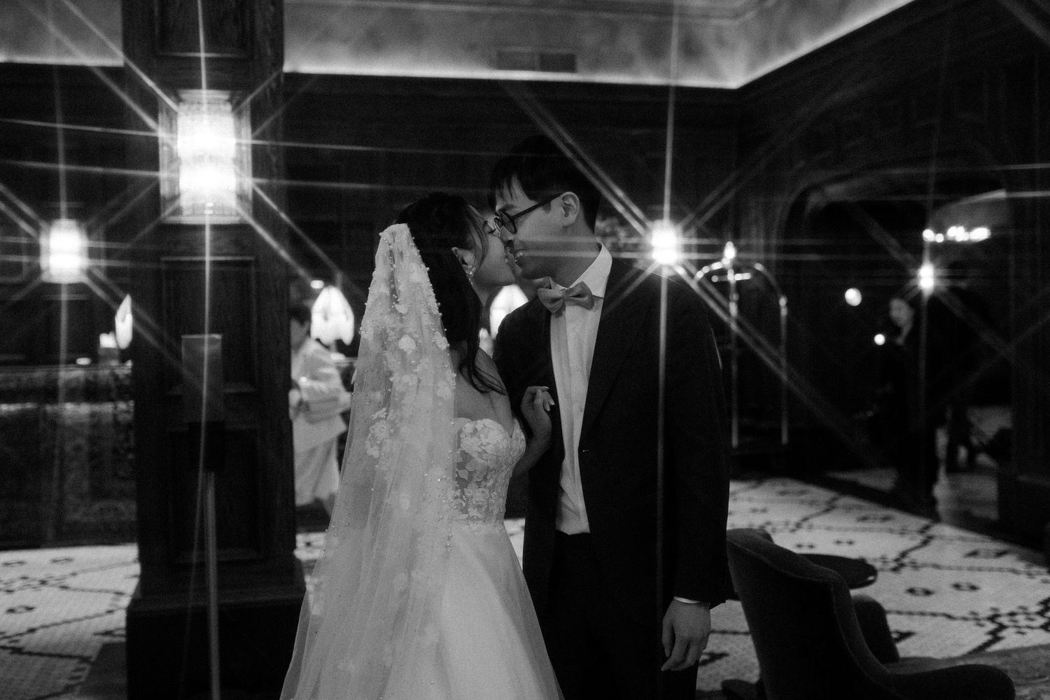 Dark and moody wedding photography with dramatic lighting and silhouettes.