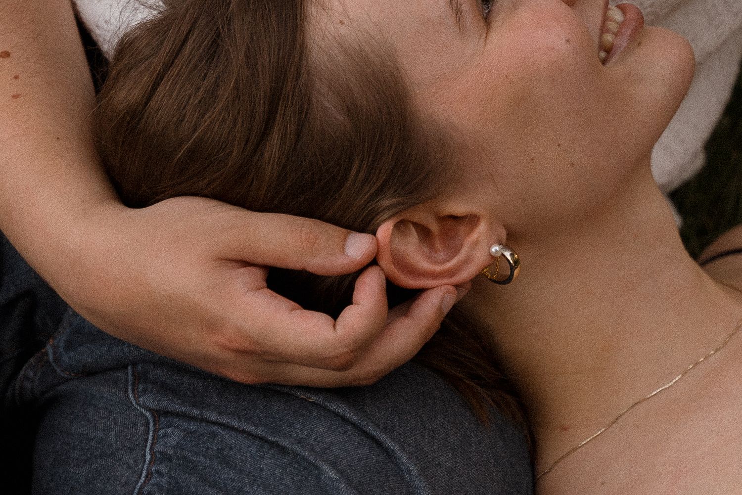 Intimate close-up portrait showing tender moments between two people.