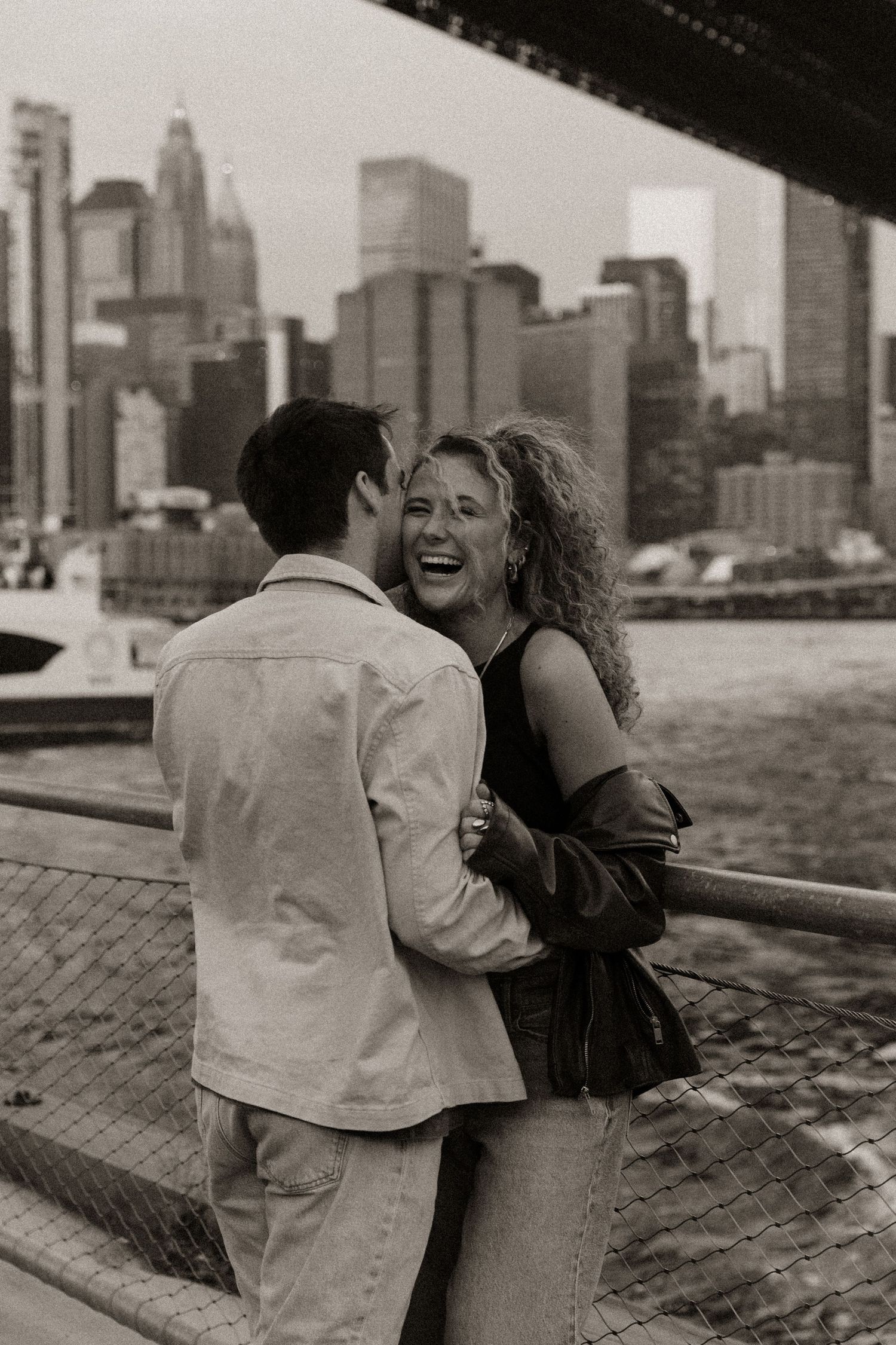 A black and white photo sequence shows a couple embracing against a city skyline backdrop.