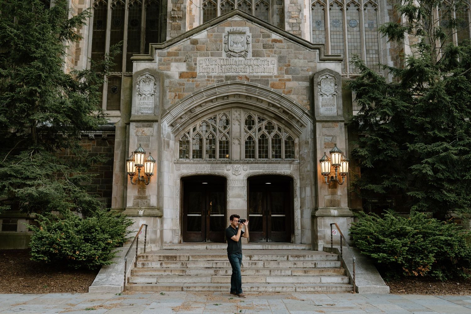 Gothic stone church entrance with ornate architecture and arched doorway.