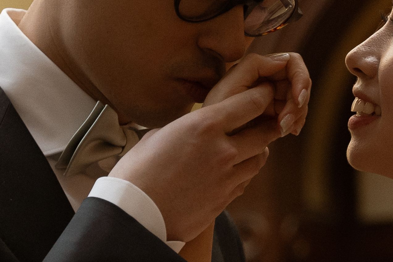 Close-up shot of an intimate moment between a bride and groom during their wedding ceremony.