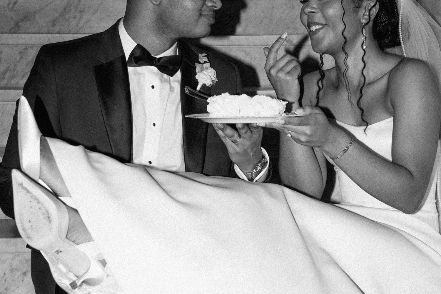 Wedding reception celebration captured in candid black and white photography.