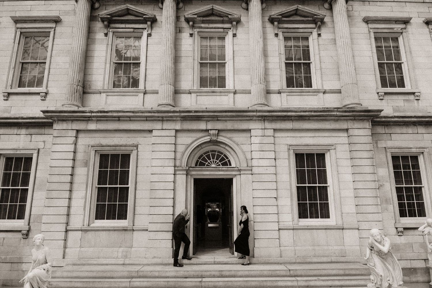 Classic stone building exterior with elegant architectural details and multiple windows.