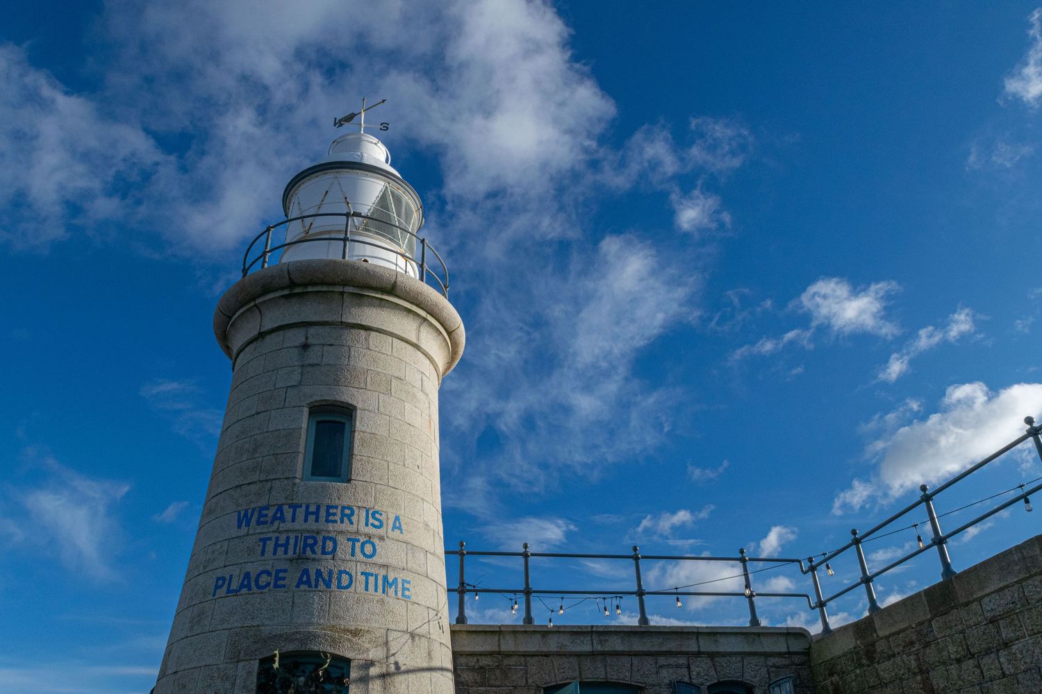 Folkestone lighthouse in fron of blue sky, seaside photography Kent