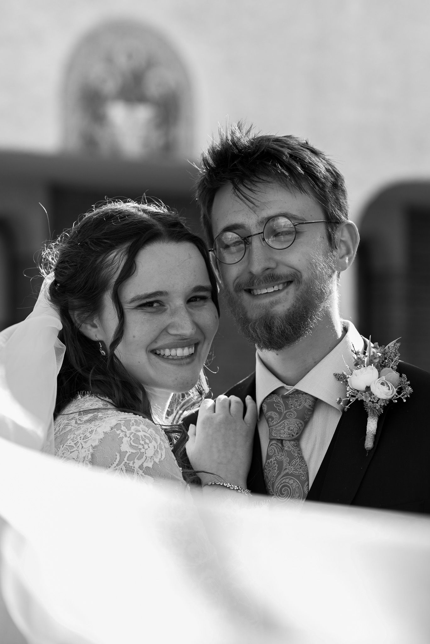 Intimate black and white wedding portraits showing tender moments between newlyweds.