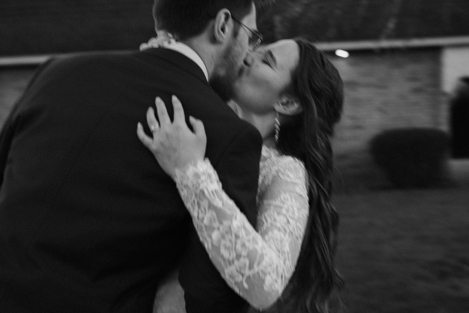 Black and white photo of intimate wedding moment.