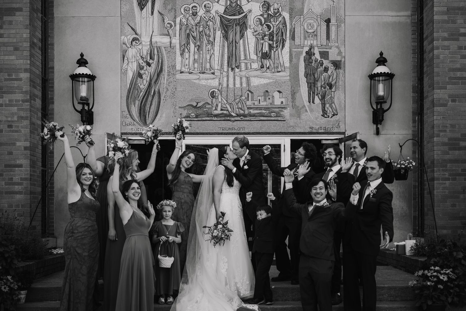 Wedding ceremony in ornate church with traditional religious artwork and architecture.