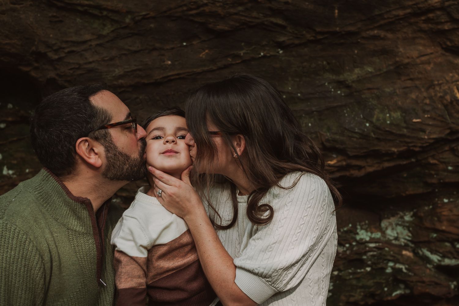 Joyful moments shared between a family in a rustic outdoor setting.