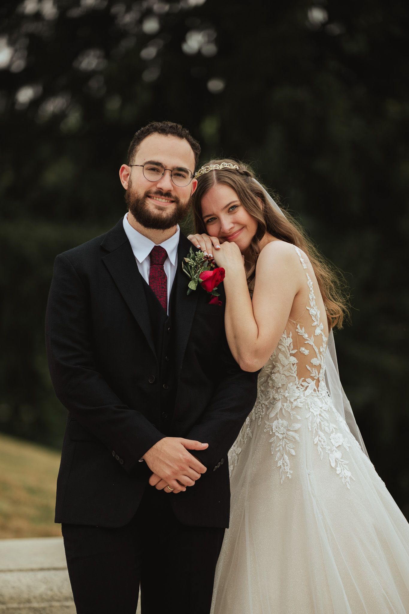 Romantic wedding portraits captured outdoors with soft natural lighting.