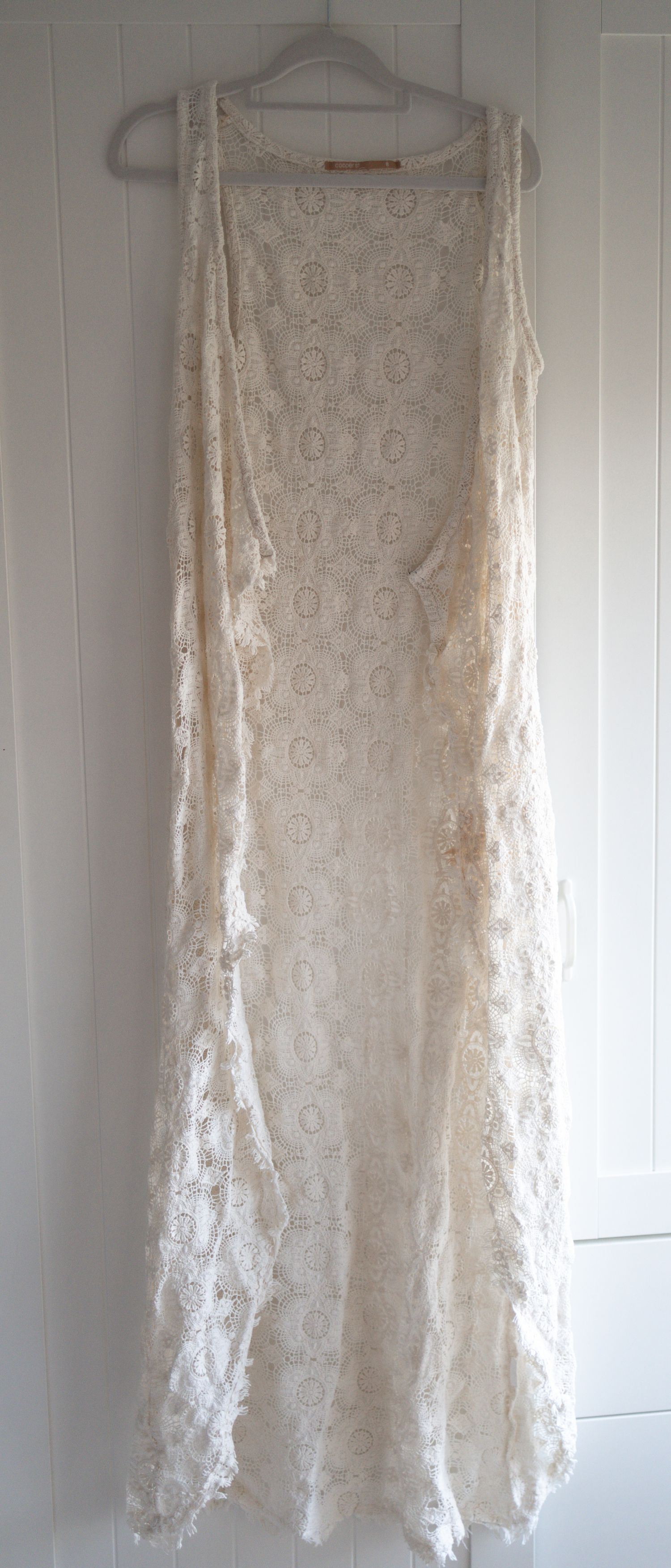 Cream ivory crochet lace sleeveless long duster vest cardigan with floral pattern, bohemian style.