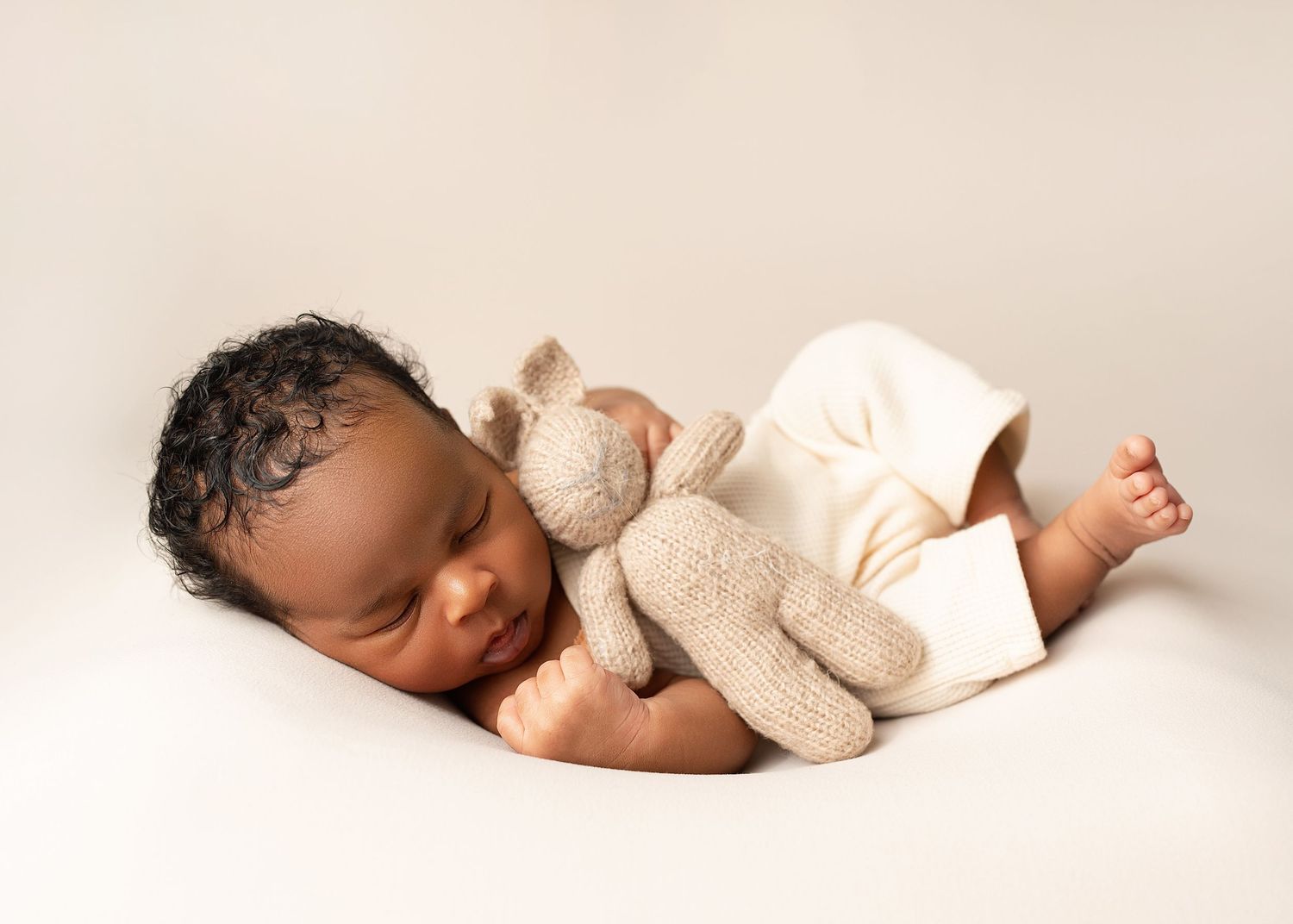 Sleeping newborn with bunny, Captured by a sought-after professional newborn photographer in Woodland Hills, Los Angeles.