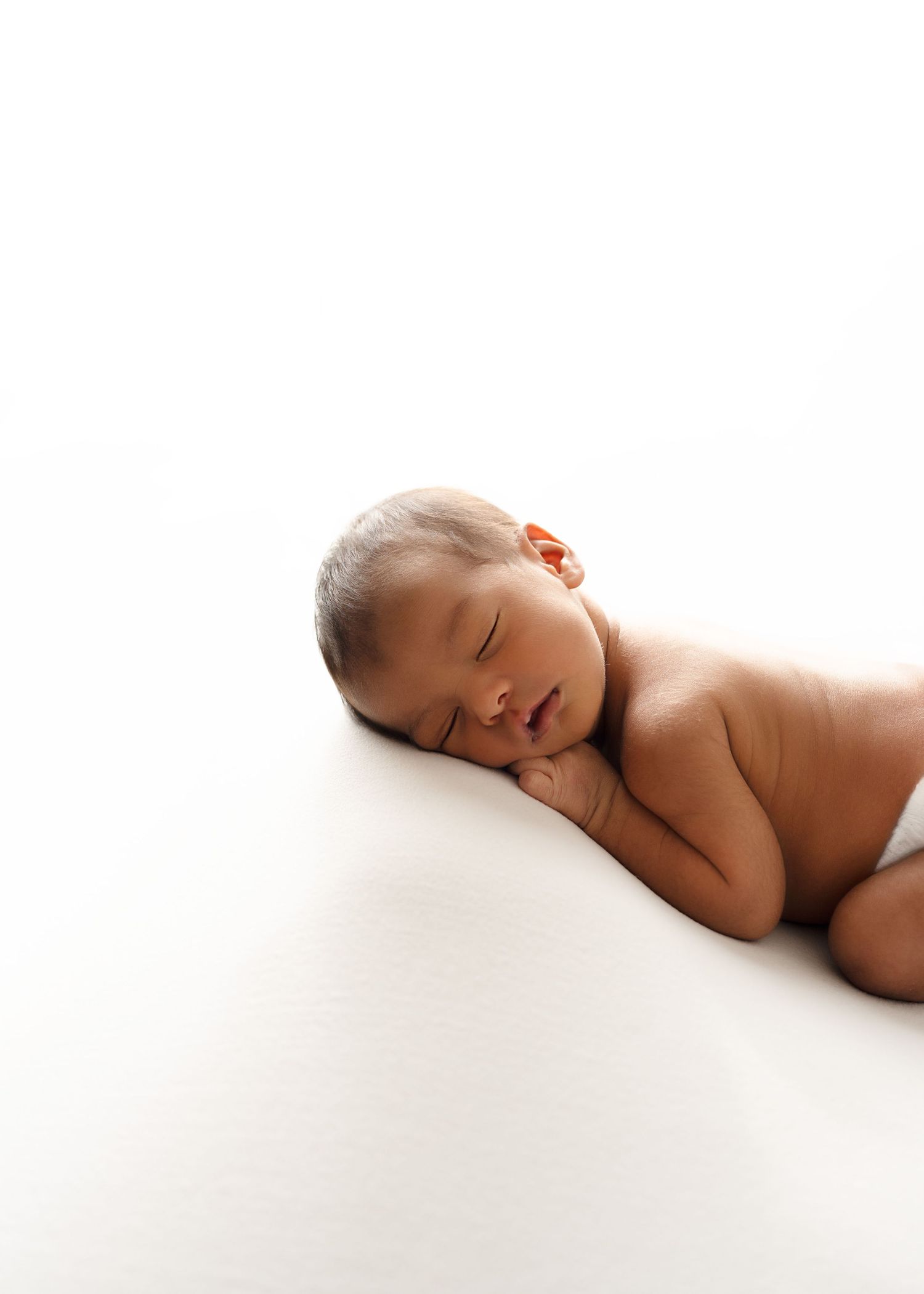 Sleeping newborn. Captured by a sought-after professional newborn photographer in Woodland Hills, Los Angeles.