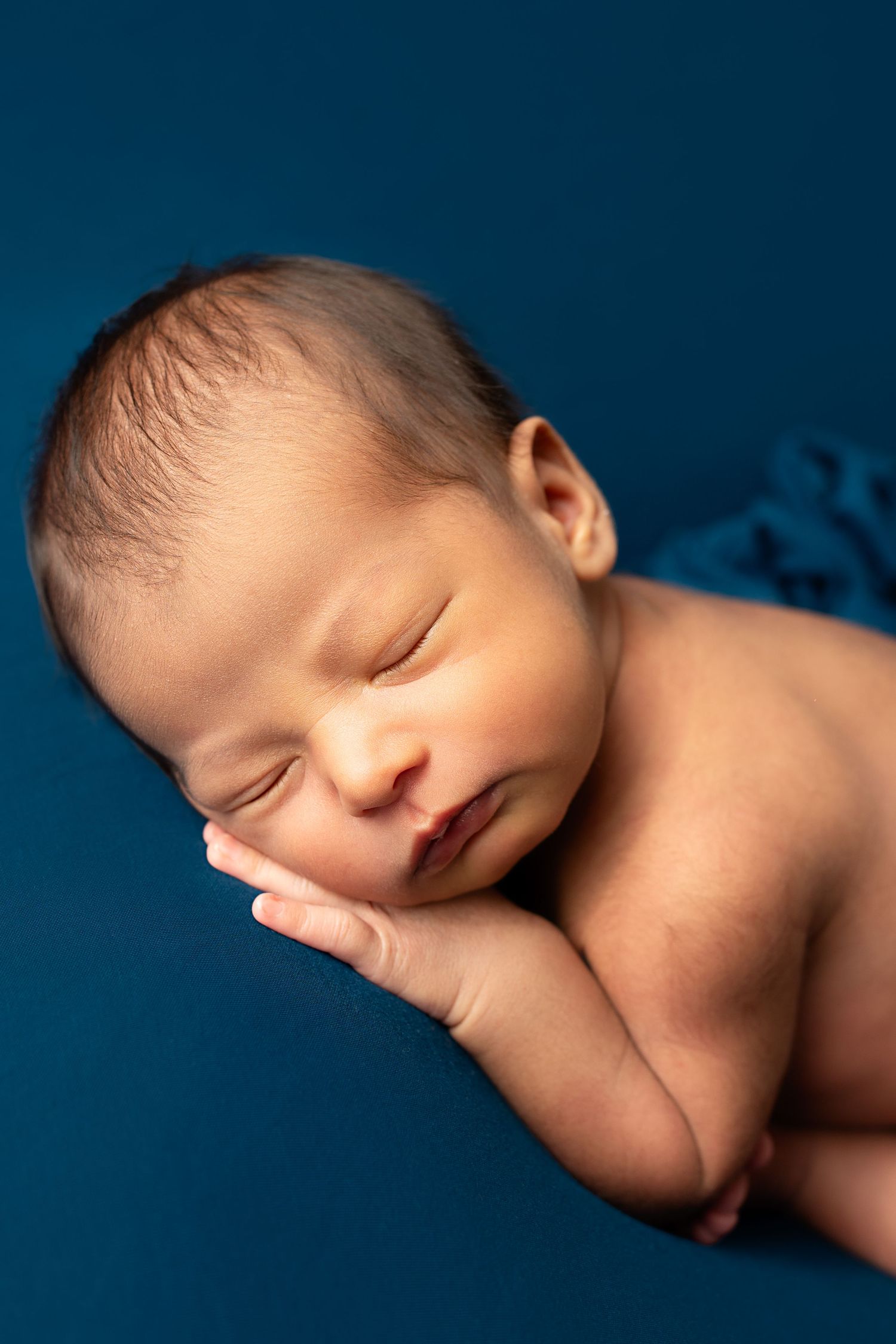 newborn sleeping Captured by a sought-after professional newborn photographer in Woodland Hills, Los Angeles.