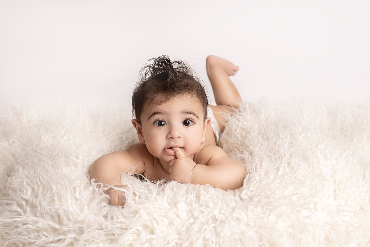 Smiling baby in our Woodland Hills studio. Amazing milestone photography in Los Angeles & the SF Valley.