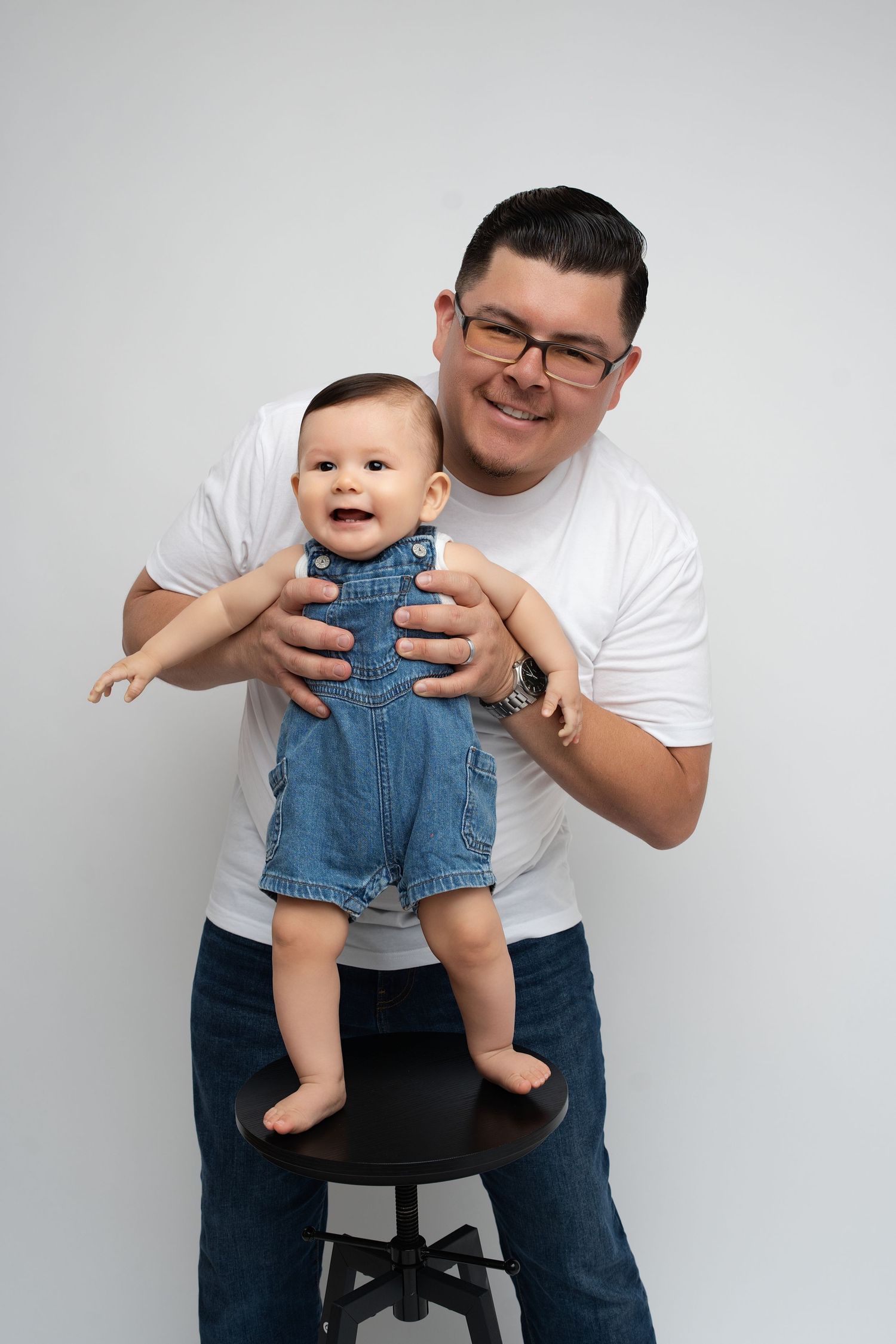 Happy family on a white backdrop. Best maternity and newborn photographers in Los Angeles, serving Woodland Hills.