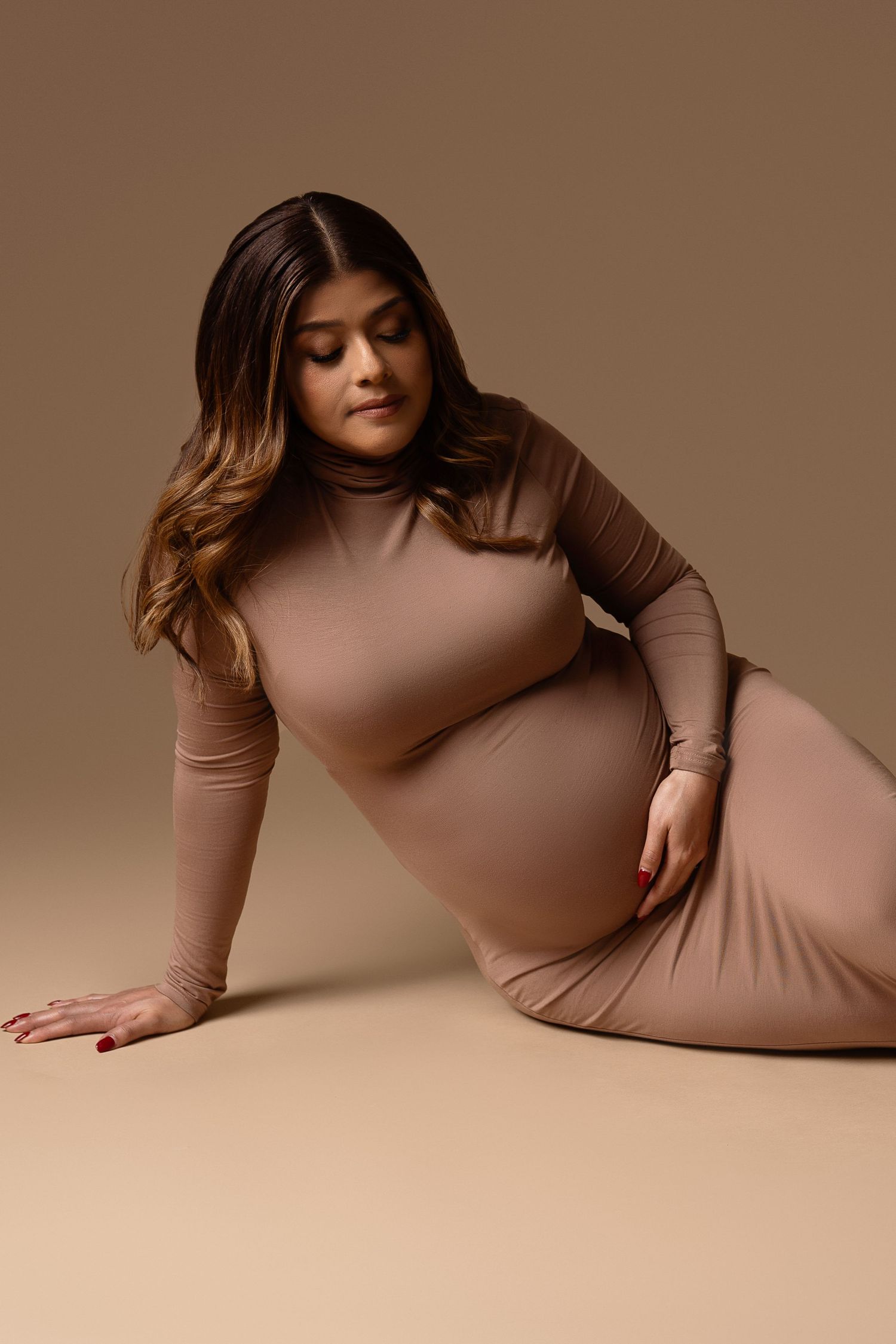 Pregnant mom in gown at our Woodland Hills studio. The best maternity photographer in Los Angeles.
