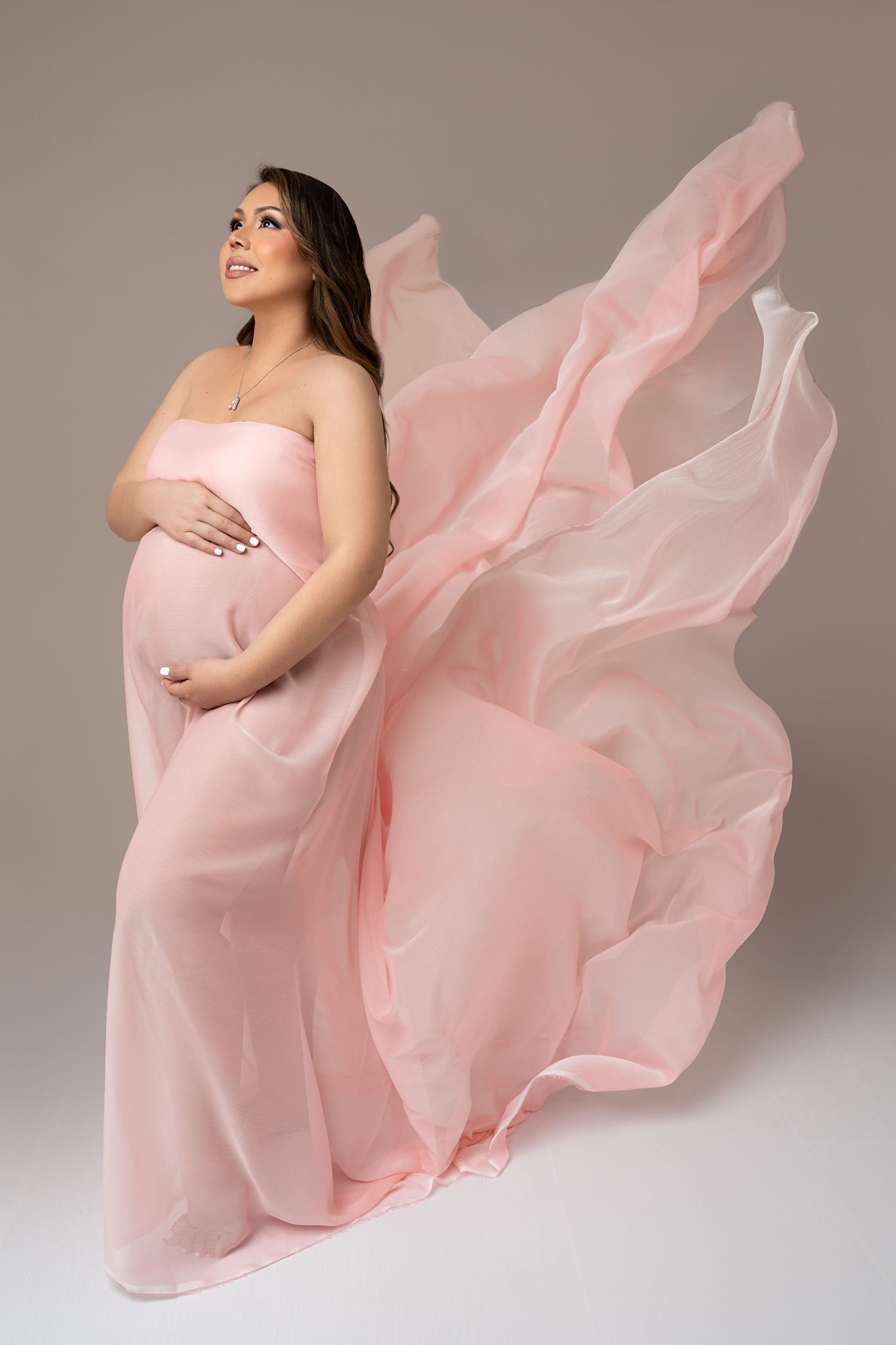 Pregnant mom in gown at our Woodland Hills studio. The best maternity photographer in Los Angeles.