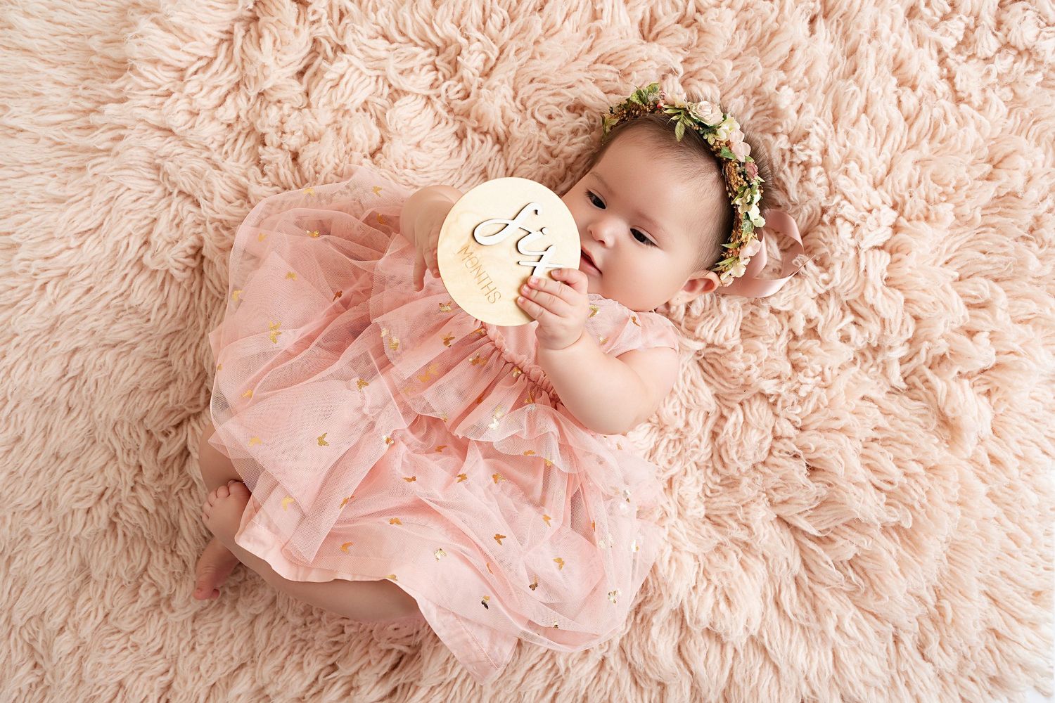 Smiling baby in our Woodland Hills studio. Amazing milestone photography in Los Angeles & the SF Valley.