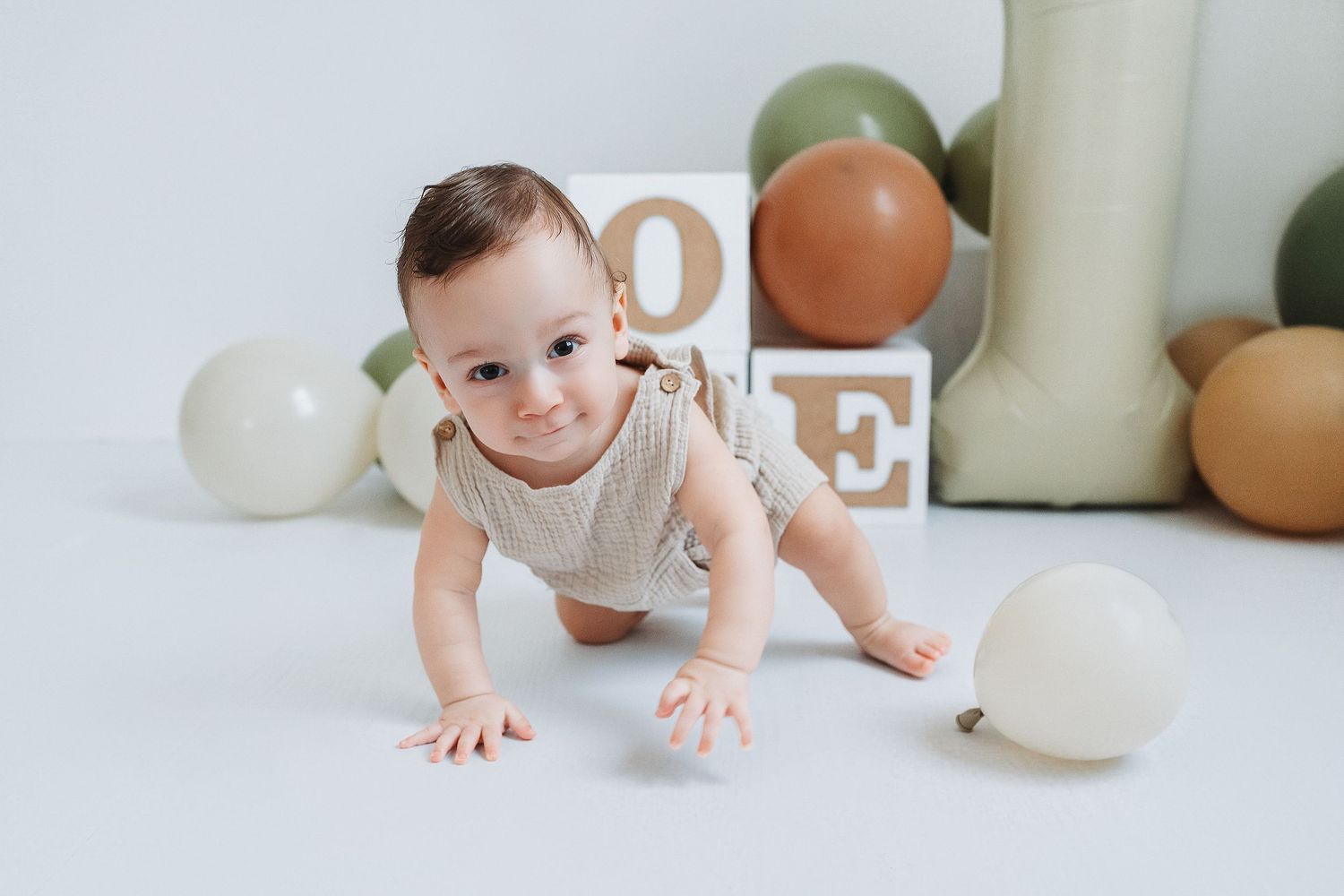 smiling baby crawling in our Woodland Hills studio. Amazing milestone photography in Los Angeles & the SF Valley.