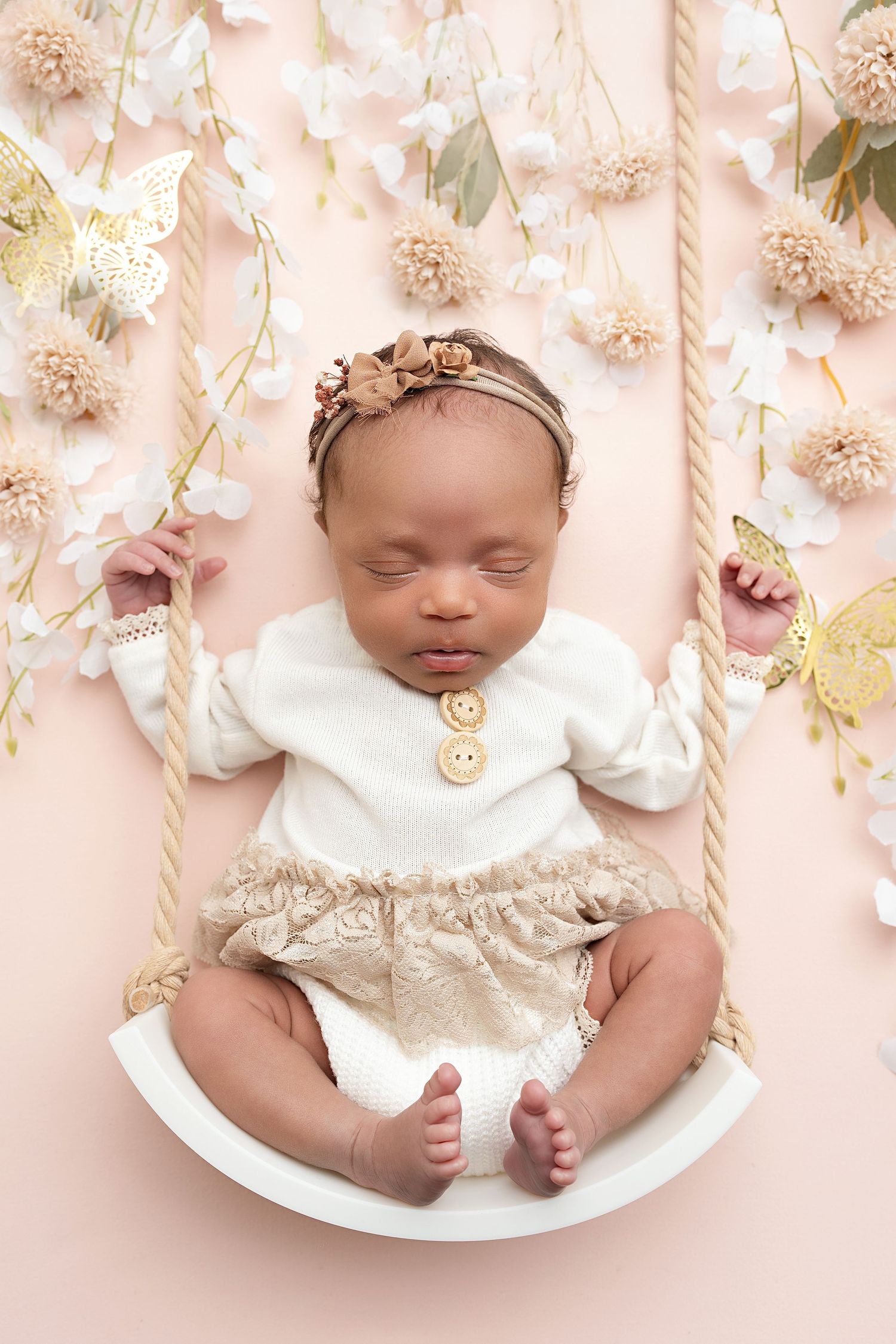 newborn on swing. Captured by a sought-after professional newborn photographer in Woodland Hills, Los Angeles.
