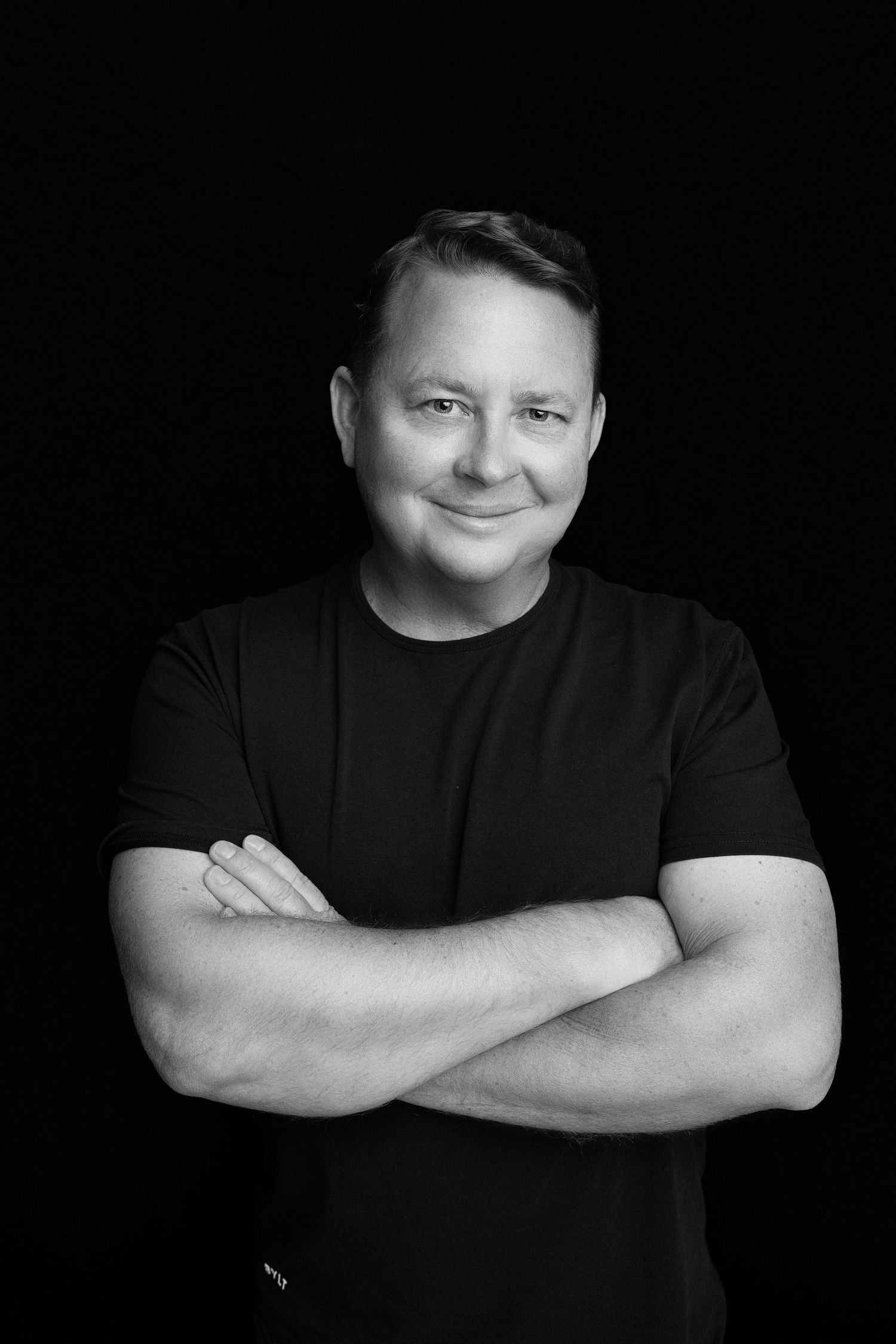 man on a black backdrop. Best maternity and newborn photographers in Los Angeles, serving Woodland Hills.