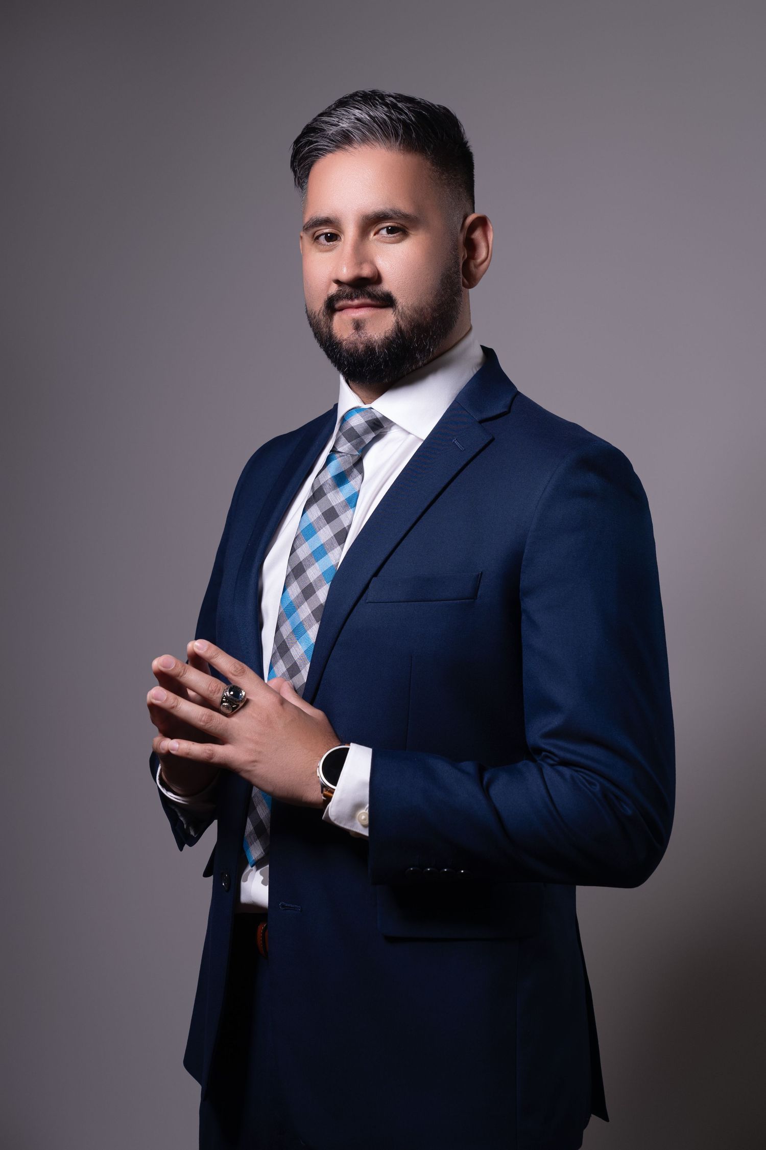 man in suite on a white backdrop. Best maternity and newborn photographers in Los Angeles, serving Woodland Hills.