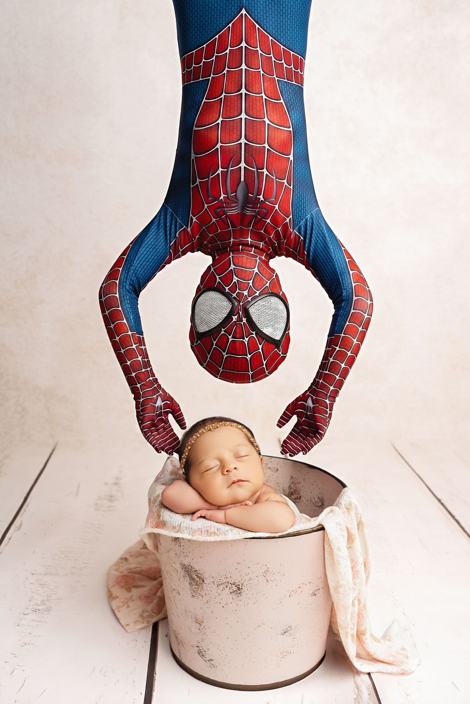 spider-man dressed sleeping newborn in bucket. Captured by a sought-after professional newborn photographer in Woodland Hills, Los Angeles.