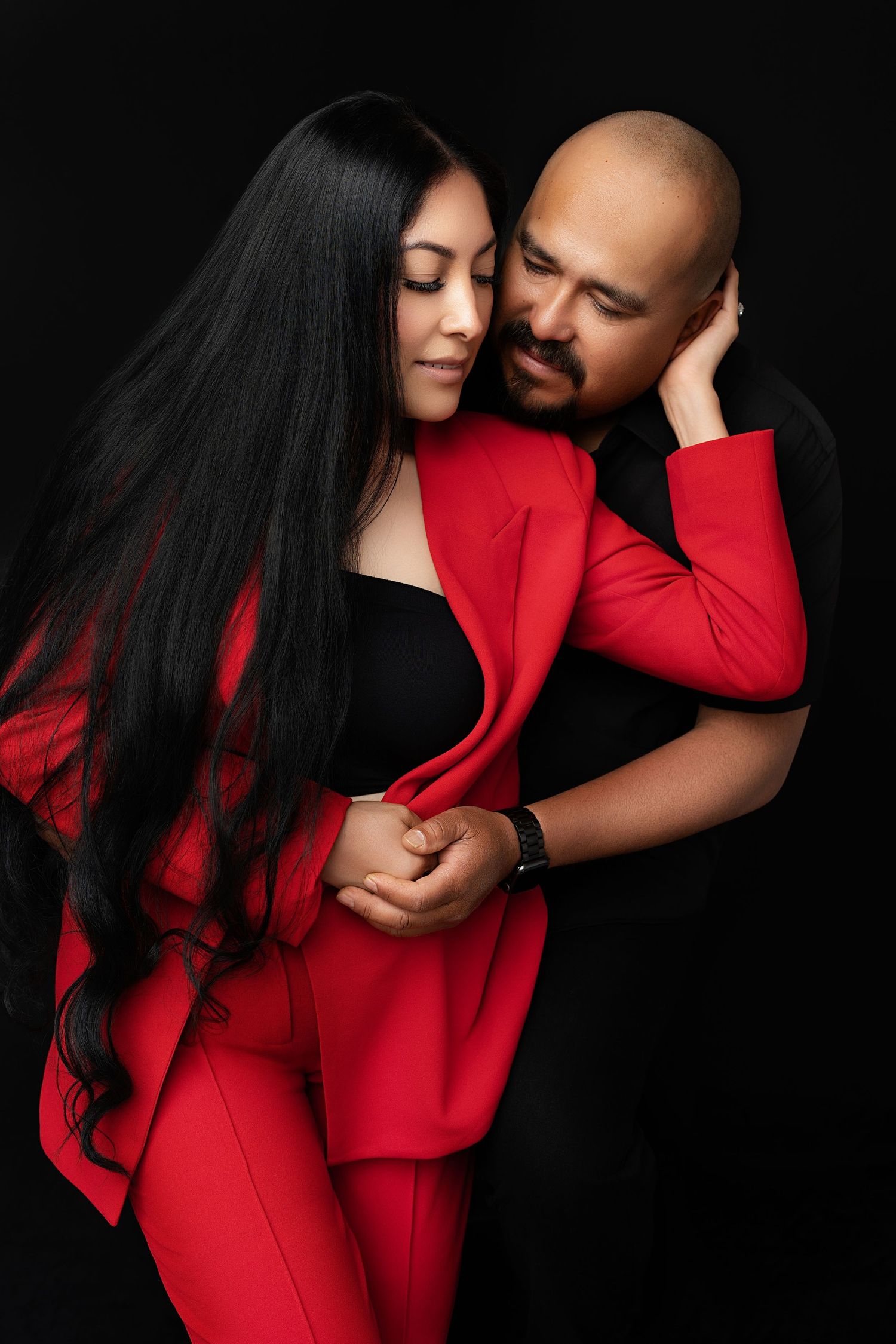Happy family on a black backdrop. Best maternity and newborn photographers in Los Angeles, serving Woodland Hills.