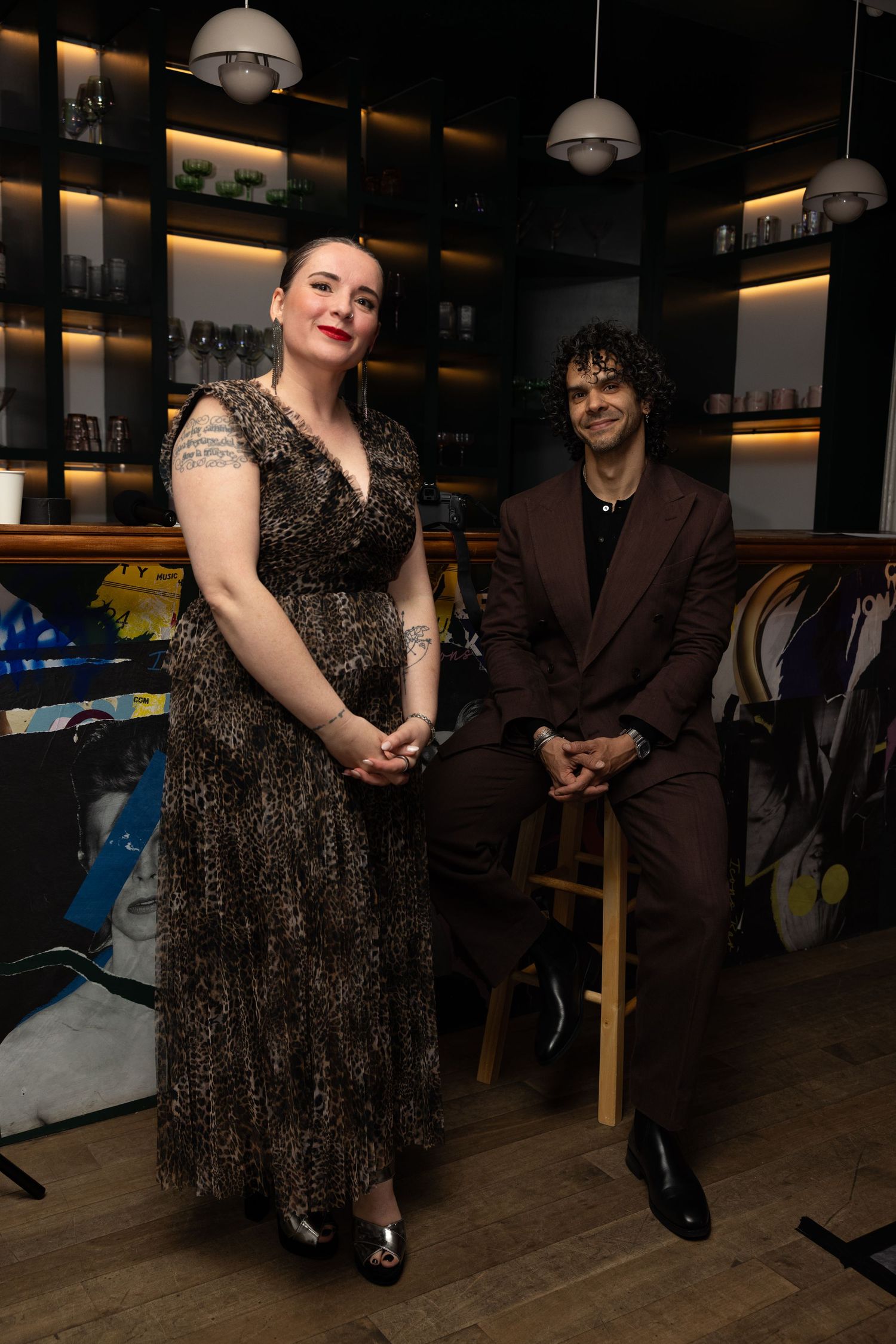 Guests posing together at a Flying Solo fashion event in New York City.