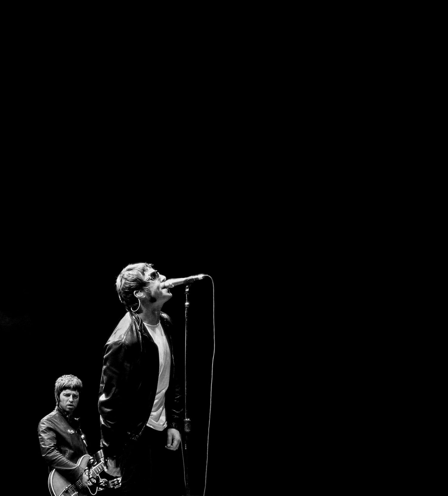 Liam and Noel Gallagher performing live with Oasis at Molson Amphitheatre in Toronto in 2005, photographed by Lisa Mark.