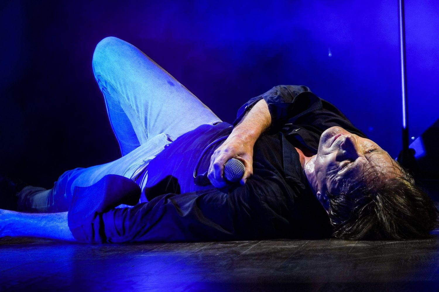 Suede performing live at Massey Hall in Toronto, photographed by Lisa Mark in 2022.