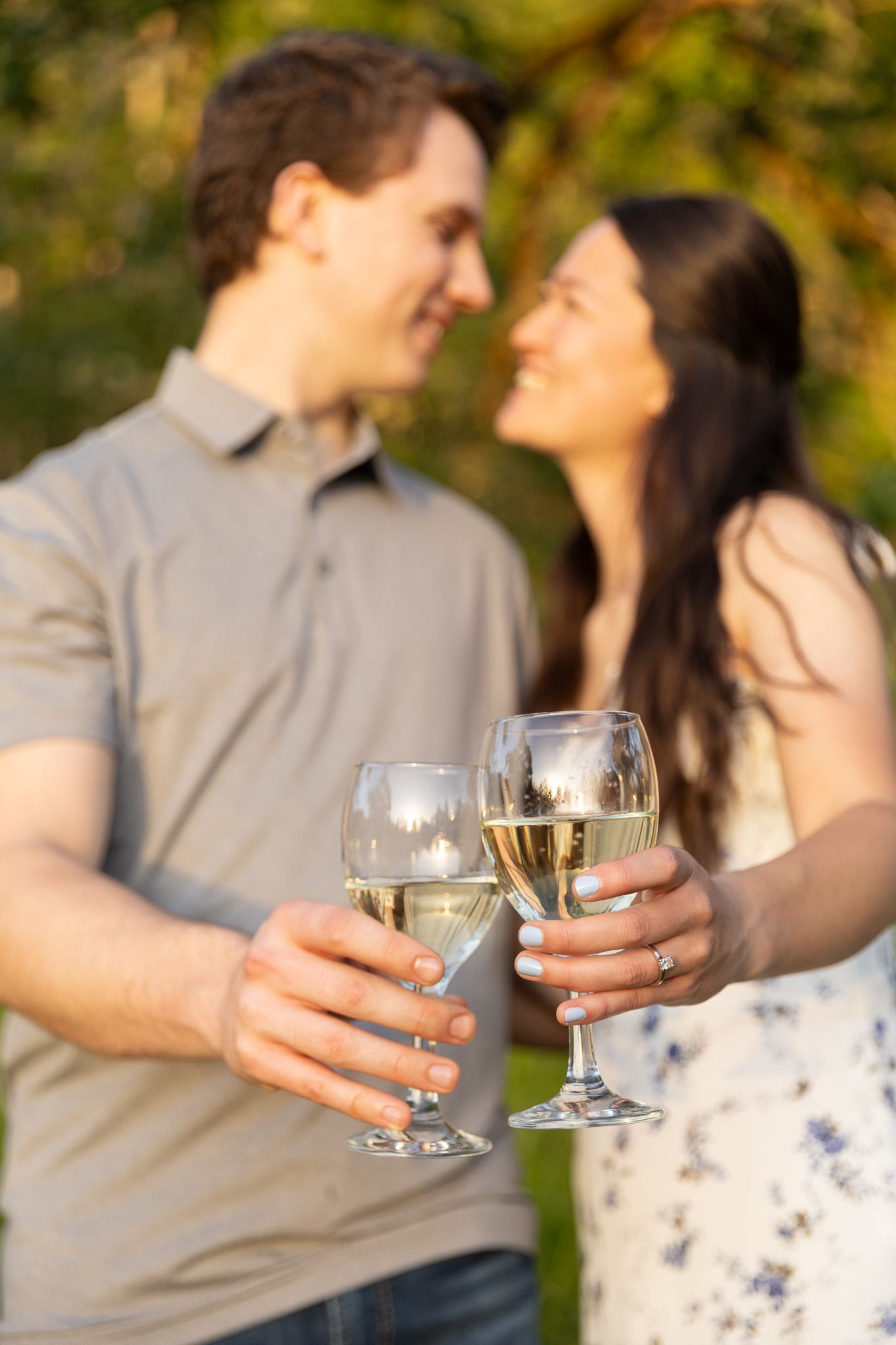 Engaged couple toasting to their marriage at Mt. Pisgah Arboretum captured by Oregon Wedding Photographer