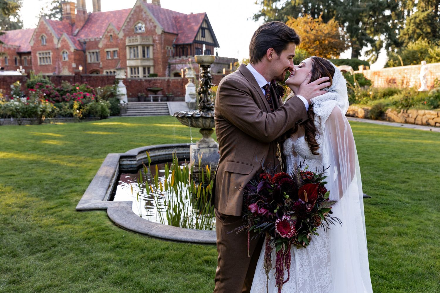 Bride and groom embracing in front of Thornewood Castle in Lakewood Washington, PNW wedding Photographer