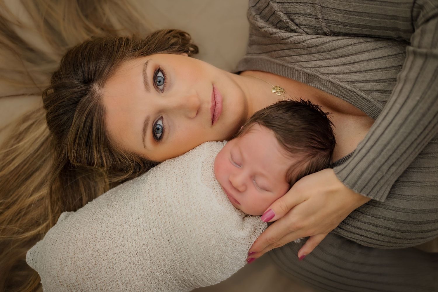 A stunning portrait of a mother with her infant. Classy and sophisticated this portrait is anything less than beautiful.