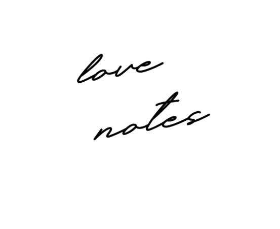 A black cursive signature handwriting on white background showing elegant flowing calligraphy.