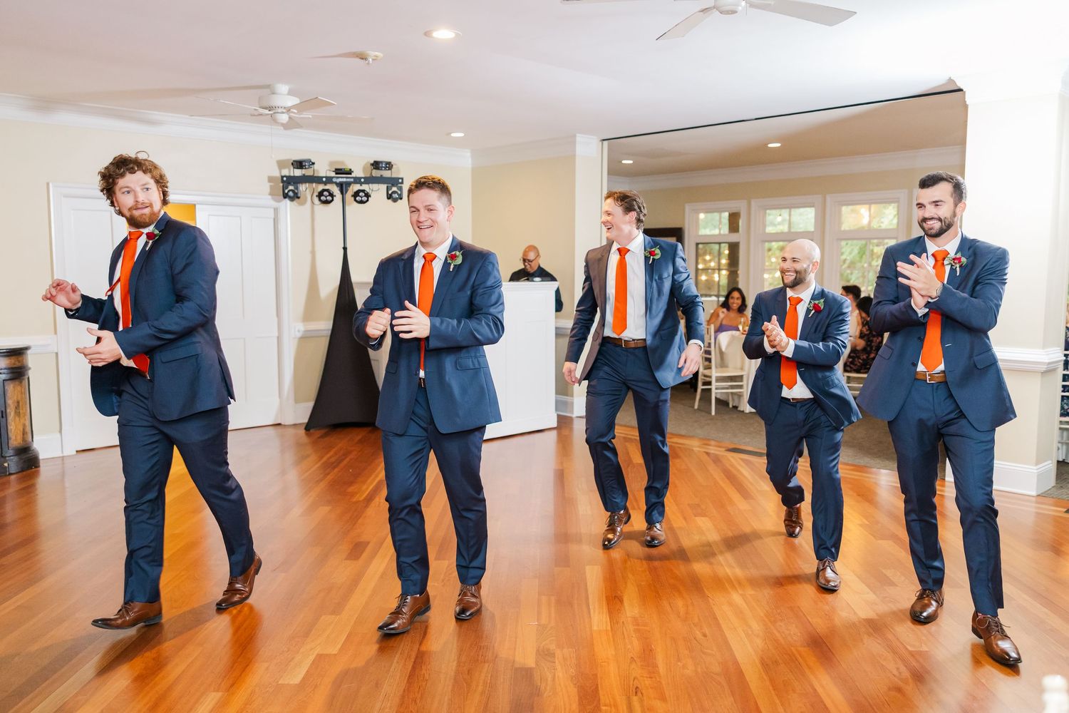 A sequence of dance moves shown in a progression across a bright hardwood floor studio space.