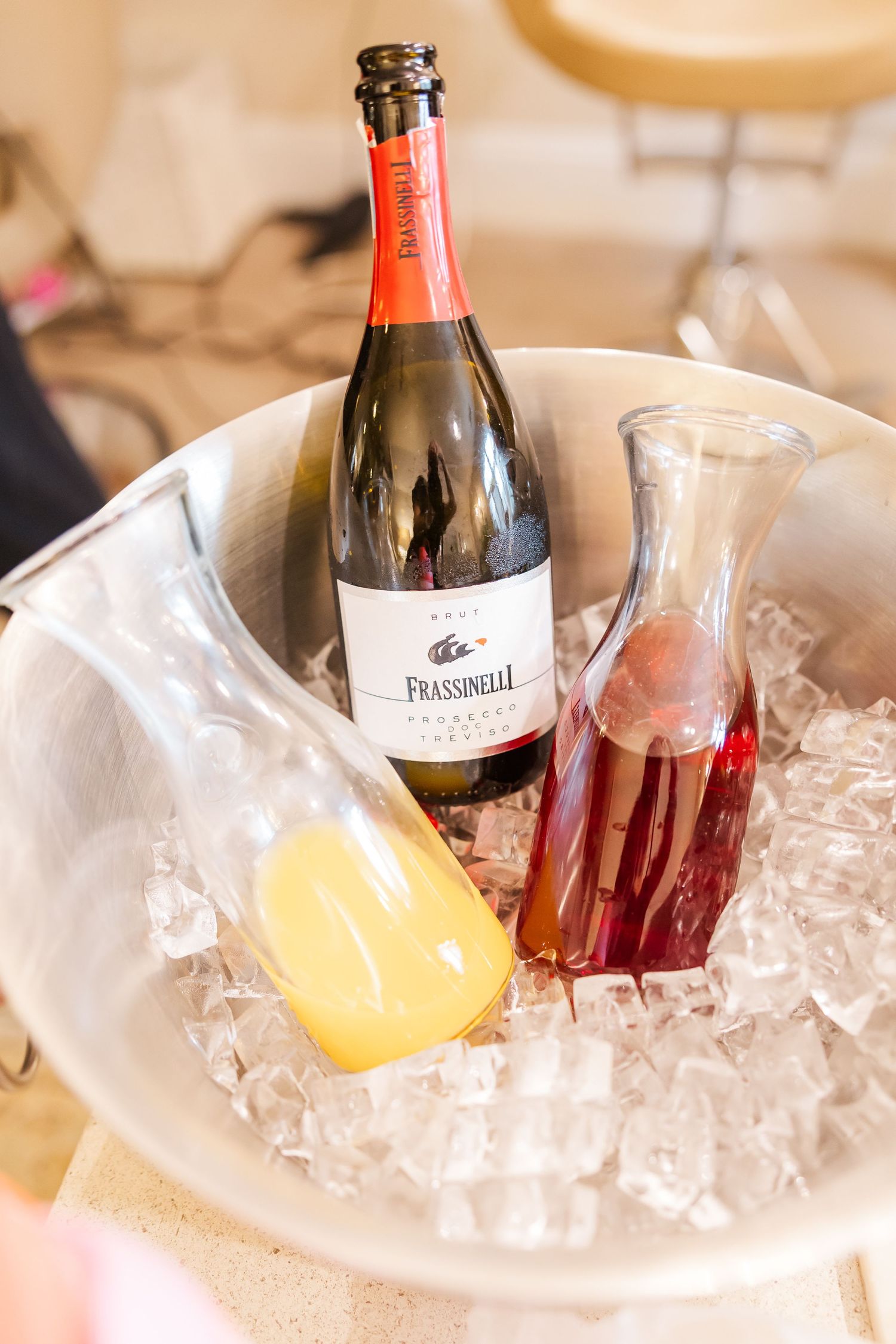 Wine and champagne bottles chilling in ice buckets at an elegant event or celebration.