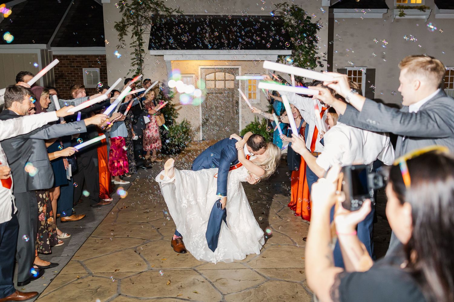 A sequence of dance lifts and spins showing a couple performing choreographed moves at a celebration or event.