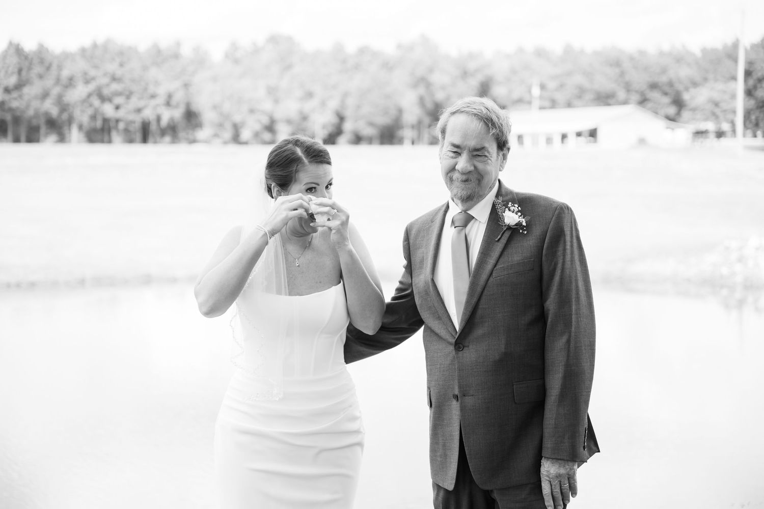 A black and white wedding photo sequence shows a couple sharing a joyful moment together outdoors.